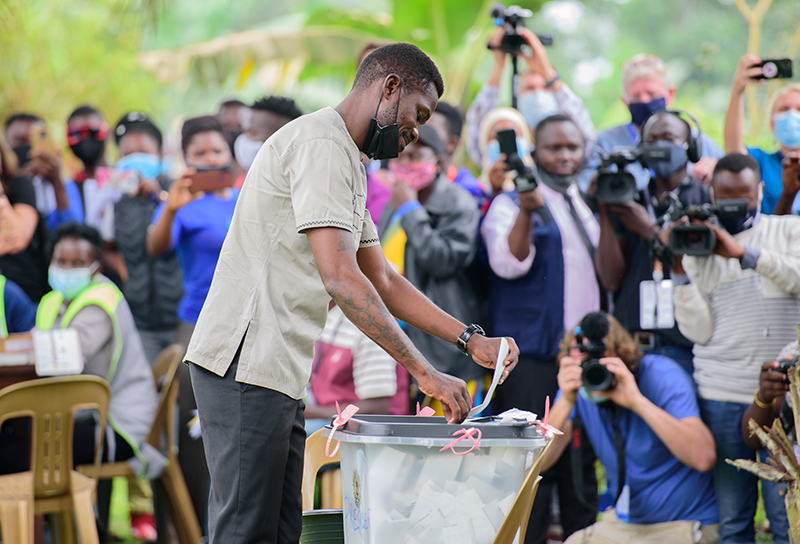 Former Presidential candidate Robert Kyagulanyi casts his vote amidst media coverage